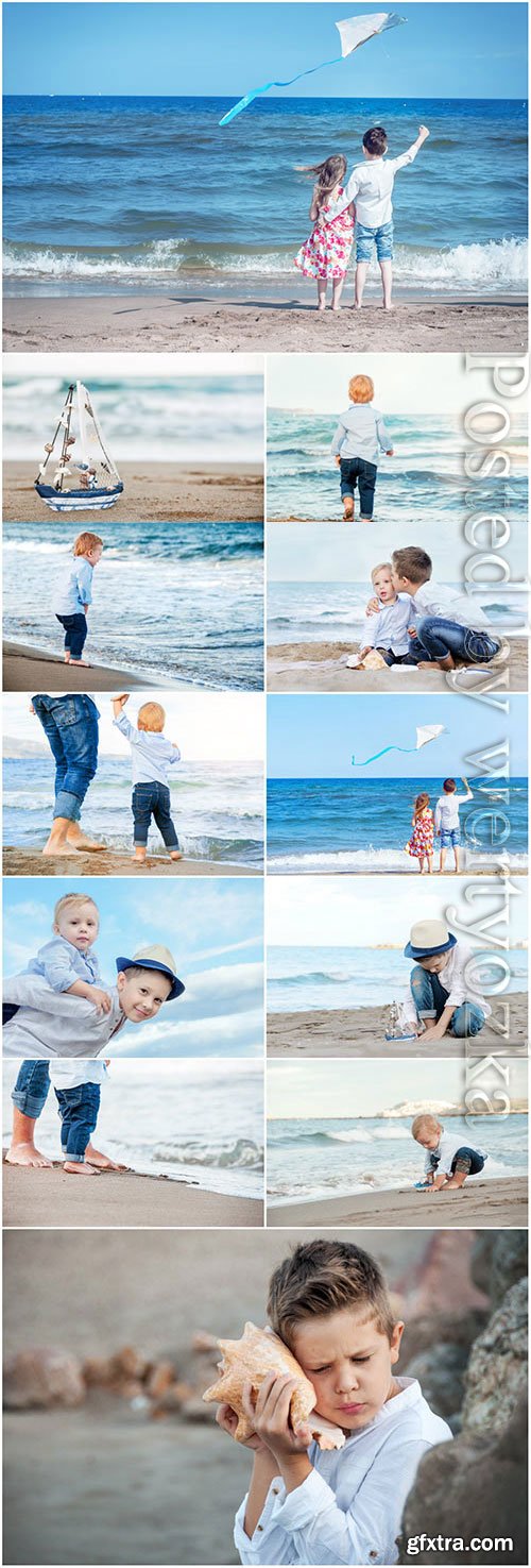 Children walking on the sea stock photo Children walking on the sea stock photo