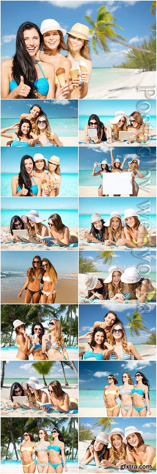 Happy girls relaxing on the sea stock photo Happy girls relaxing on the sea stock photo