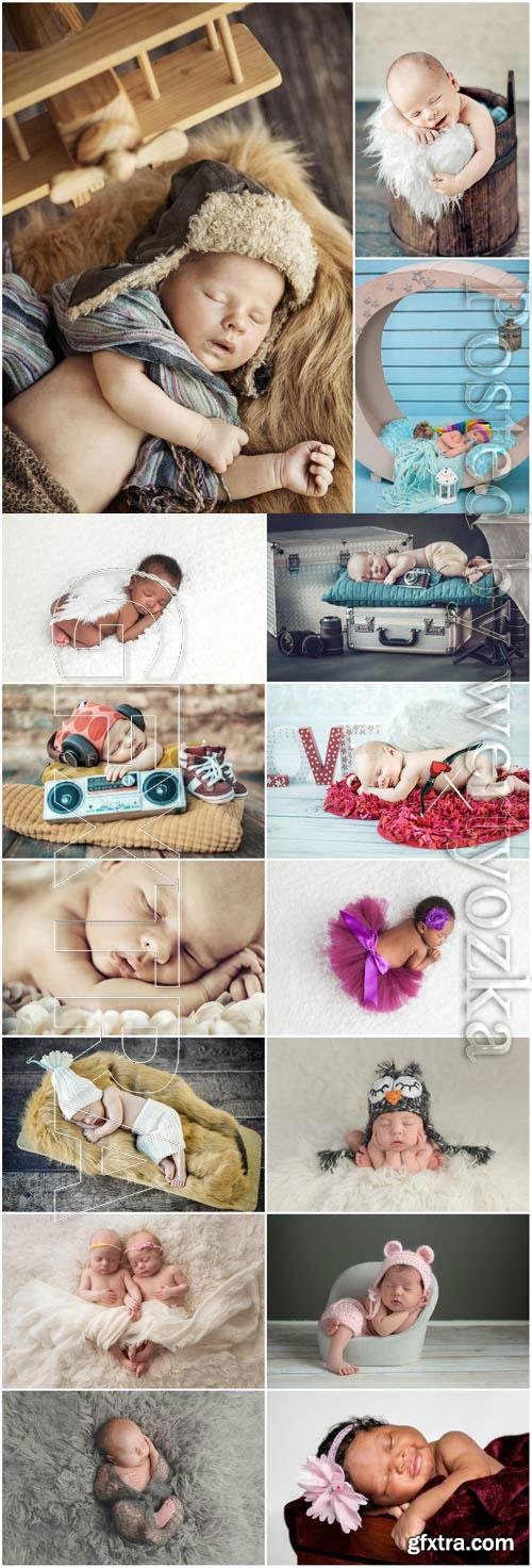 Sleeping newborn babies in the studio at a photo session stock photo