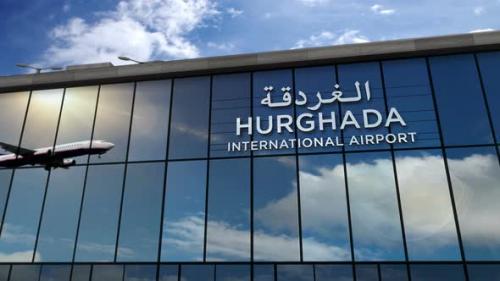 Videohive - Airplane landing at Hurghada Egypt airport mirrored in terminal - 34056520 - 34056520