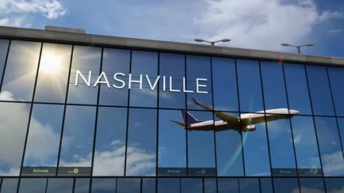 Videohive - Airplane landing at Nashville Tennessee, USA airport mirrored in terminal - 34238492 - 34238492