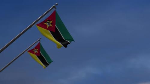 Videohive - Mozambique Flags In The Blue Sky - 4K - 34522686 - 34522686