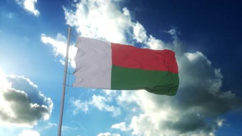 Videohive - Flag of Madagascar Waving at Wind Against Beautiful Blue Sky - 34980002 - 34980002