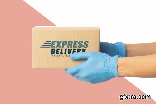 Closeup delivery man hand in medical gloves holding cardboard box mockup
