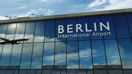 Videohive - Airplane landing at Berlin Germany airport mirrored in terminal - 38305716 - 38305716