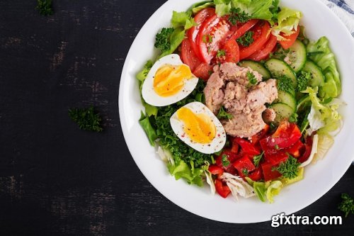 Boiled eggs ham olives tomatoes and fresh salad