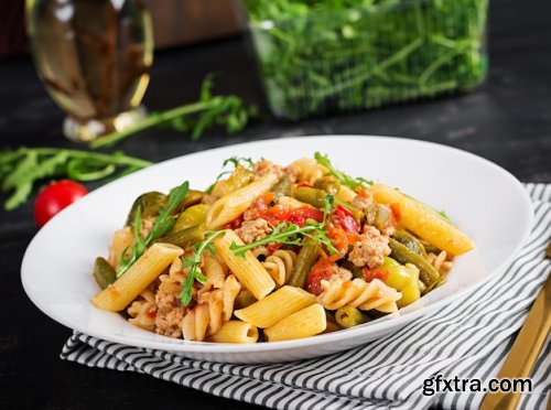 Italian pasta penne and fusilli with minced meat and vegetables