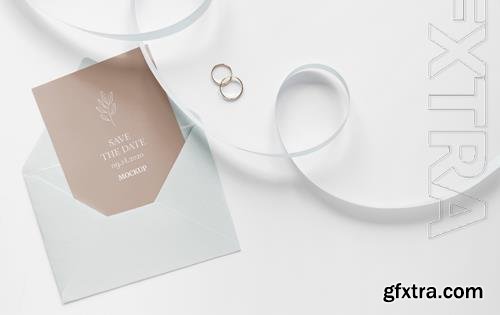 PSD top view of wedding card with ribbon and envelope PSD top view of wedding card with ribbon and envelope