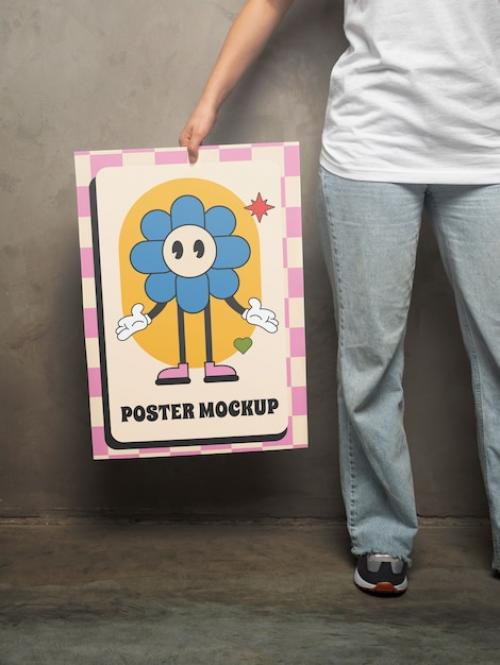 Premium PSD | Person holding poster mockup Premium PSD