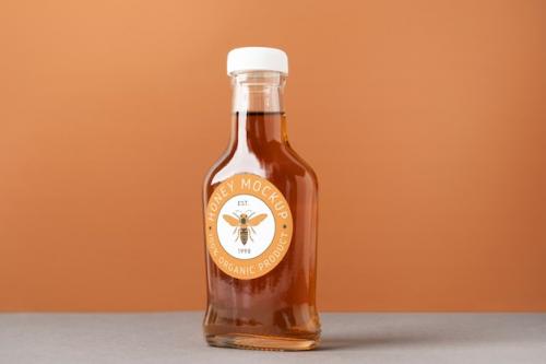 Glass Bottle Mockup With Honey Inside