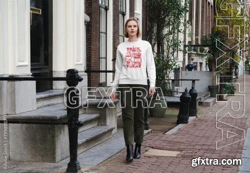 Mockup of woman in customizable sweatshirt outside building 799805713