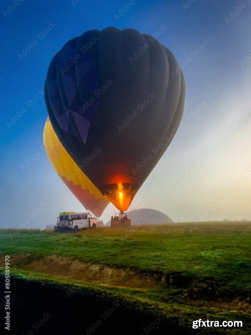 Hot-Air Balloon Flying Over The Hills And Mountains Above The Clouds 6xJPEG
